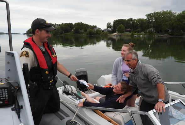 A Fishery Officer meeting boaters