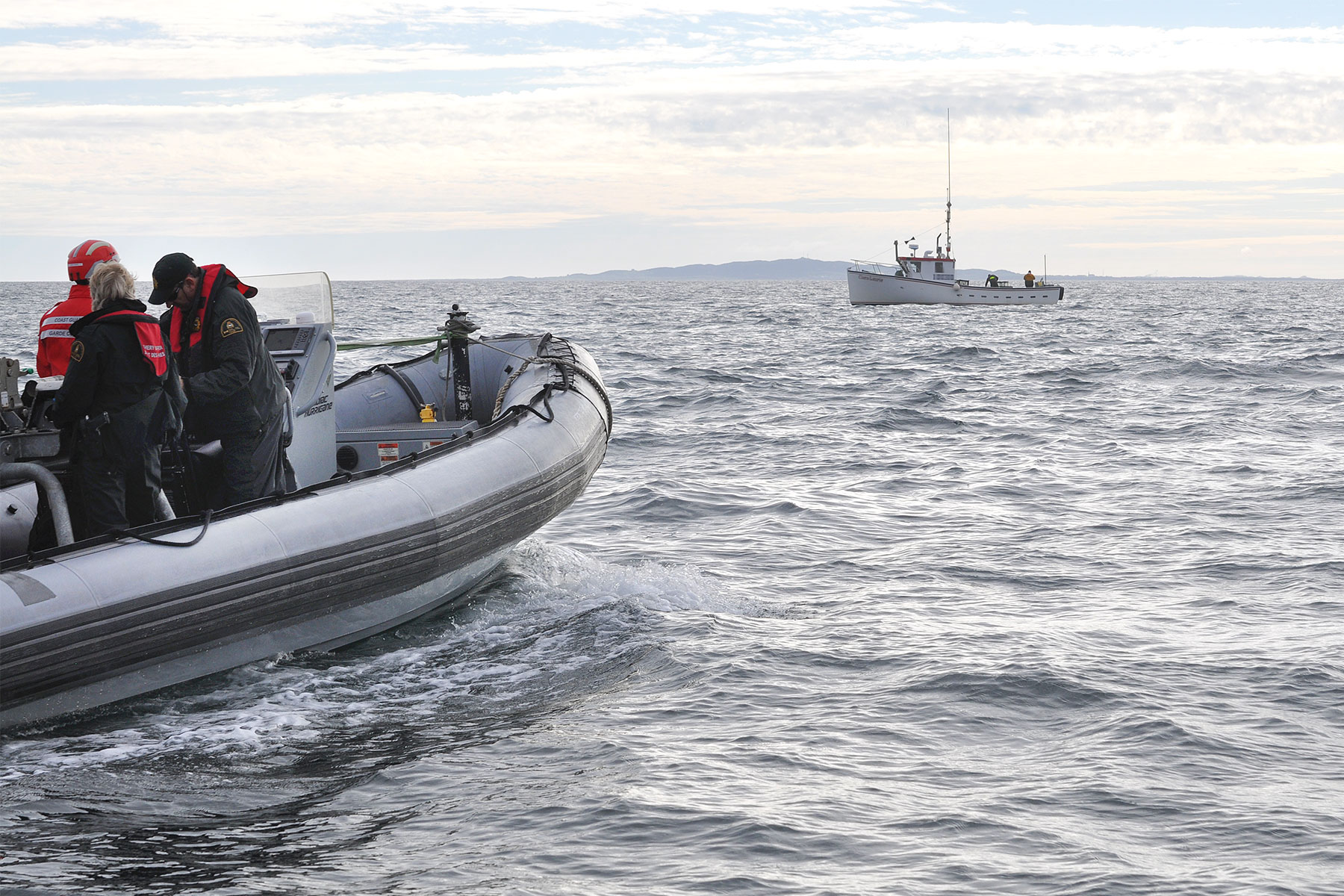 Photo showing a patrol heading toward a fishing boat