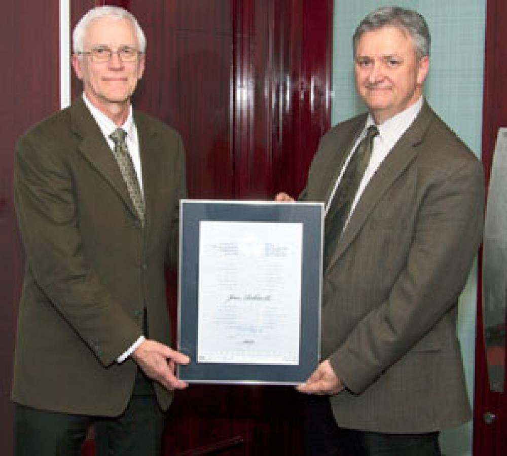 Jean Robitaille (left) receives one of the five 2013 National Recreational Fisheries Awards for his commitment to conservation from Richard Nadeau, Regional Director General, Fisheries and Oceans Canada.